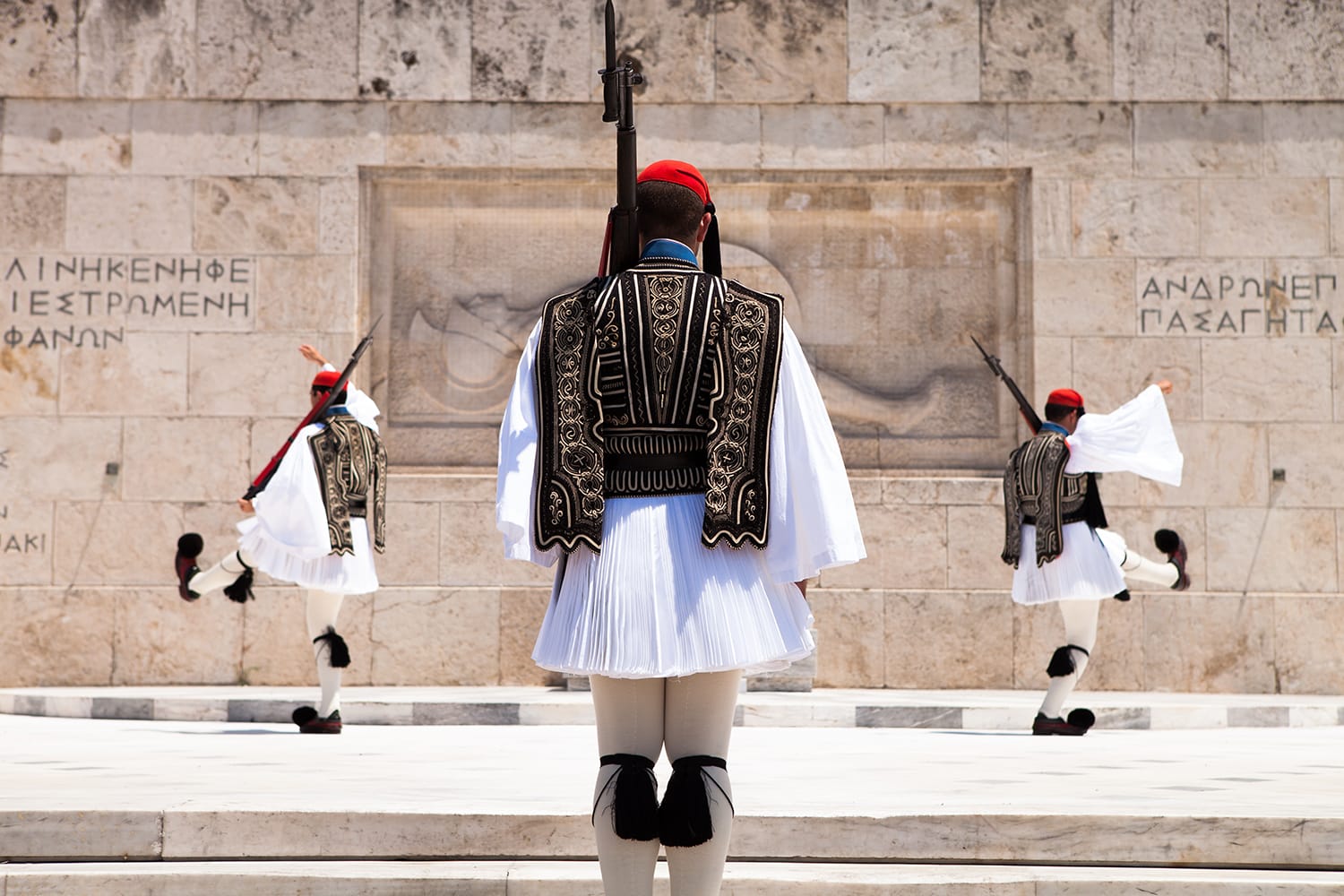 The Changing of the Guard ceremony takes place in front of the Greek Parliament Building in Athens, Greece.