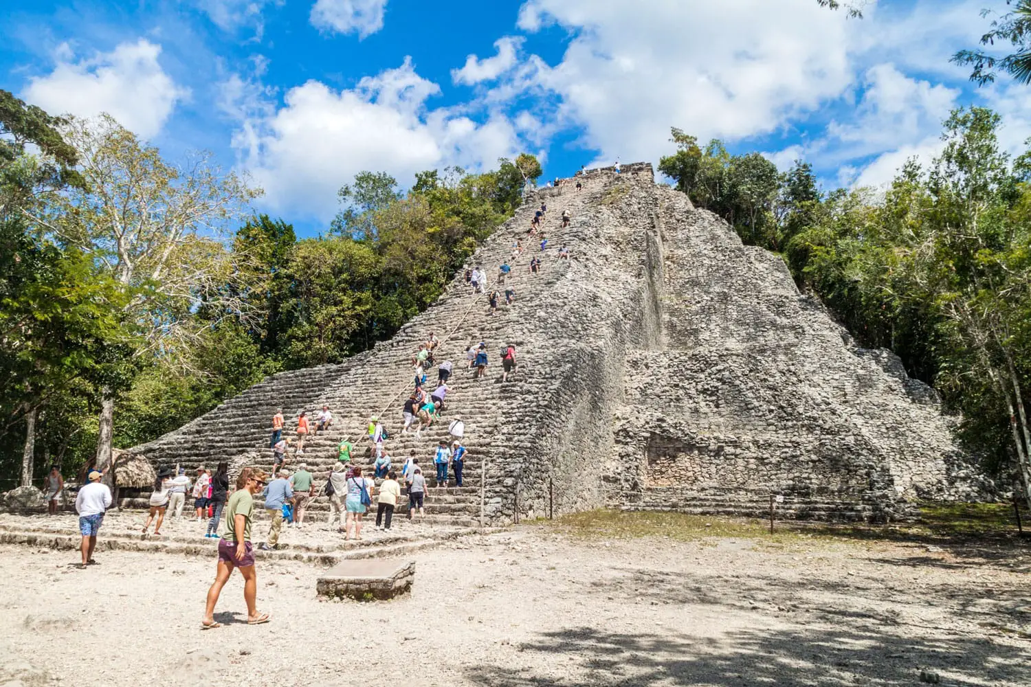 Tourist climb the Pyramid Nohoch Mul at the ruins of the Mayan city Coba, Mexico