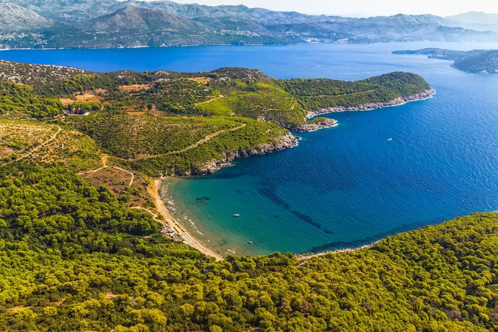 Sandy beach on Elaphites island Lopud with a view to the Dubrovnik archipelago.