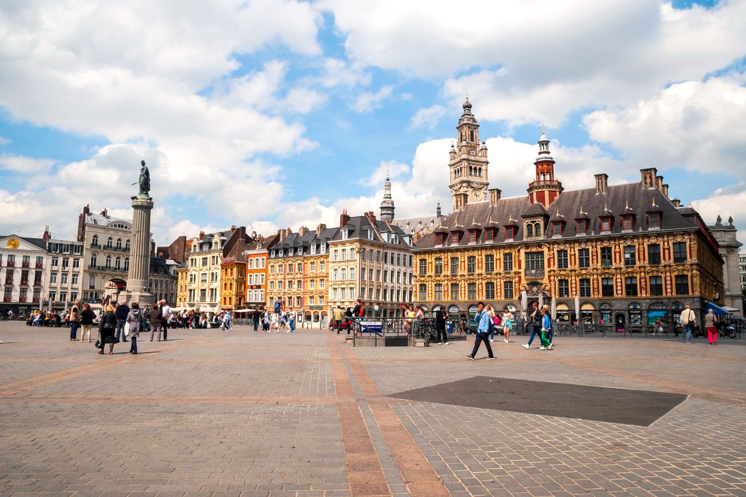 People passing Central town square, La Grand Place in Lille, France