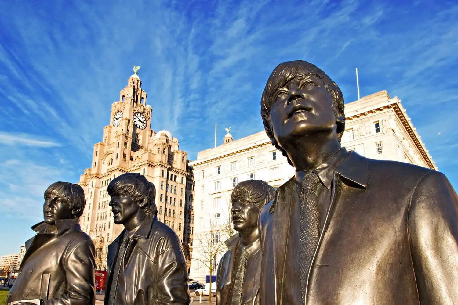 Bronze statue of The Beatles sculpted at the Pier Head in Liverpool