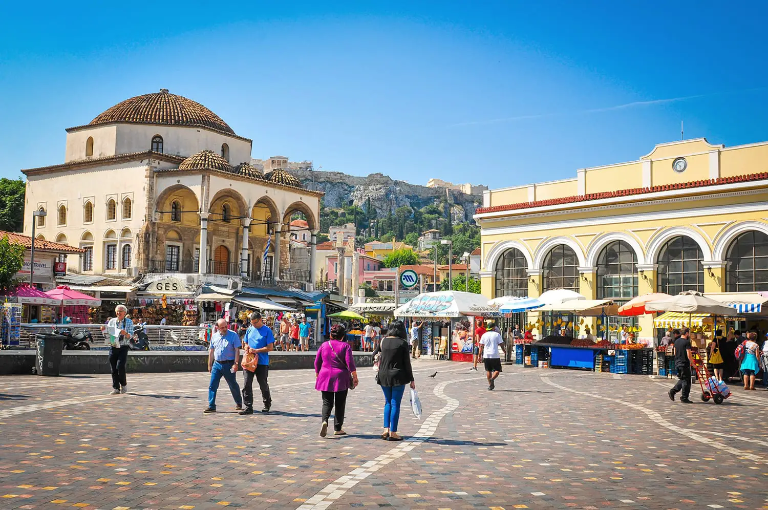 People shop in Monastiraki, a flea market square in the old town of Athens, Greece