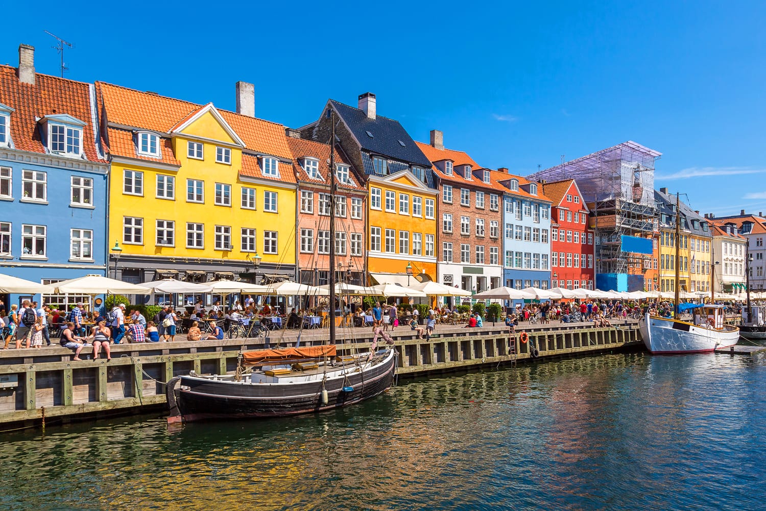 Nyhavn district is one of the most famous landmark in Copenhagen in a summer day