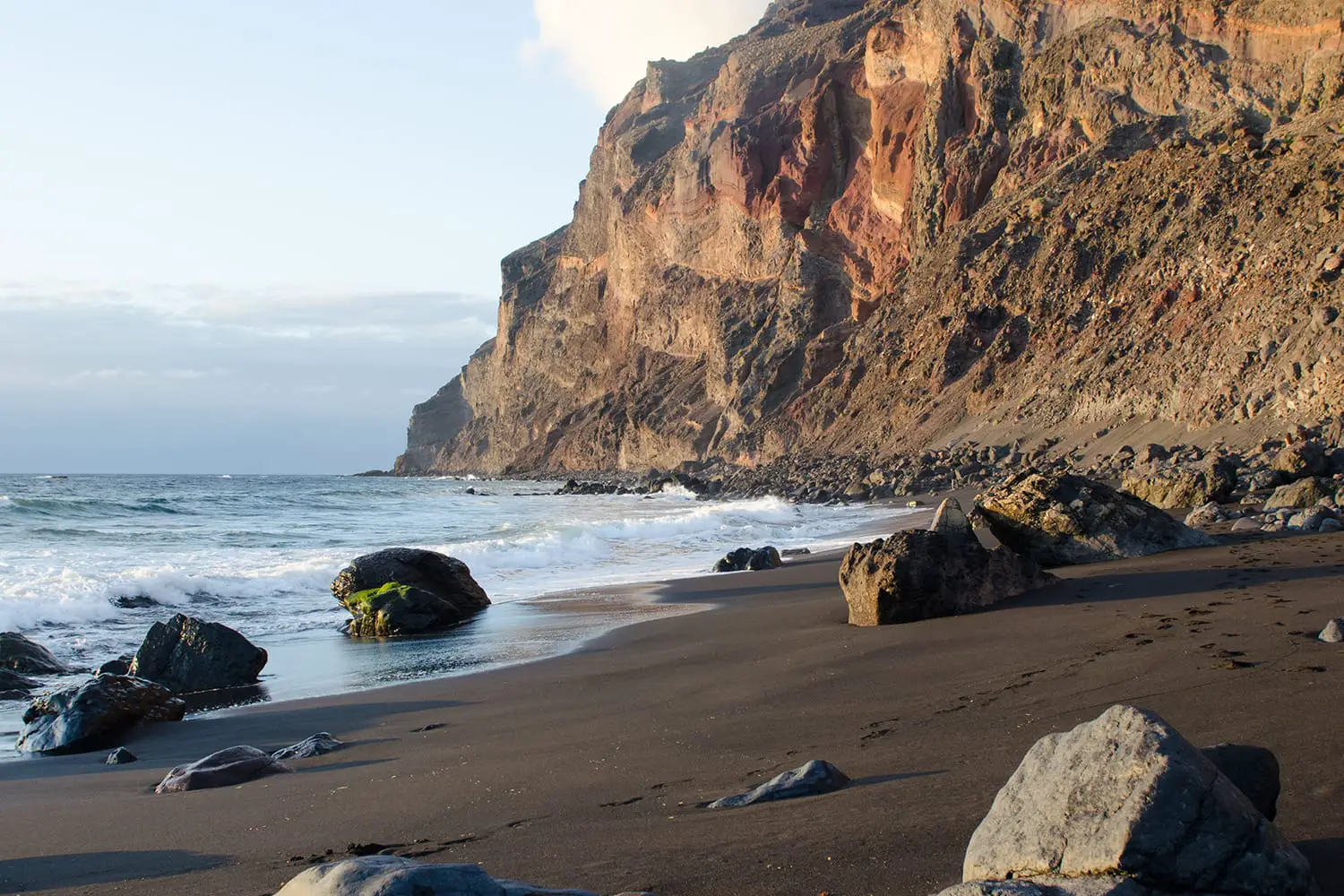 Playa del ingles beach, black sand beach at the atlantic ocean in La Gomera, one of the Canary Islands, Spain