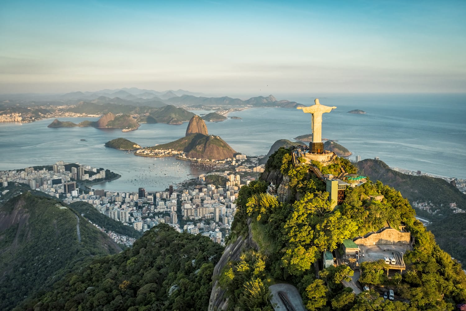 Aerial view of Christ The Reedemer Statue and Sugar Loaf Mountain from high angle. Rio de Janeiro in Brazil.