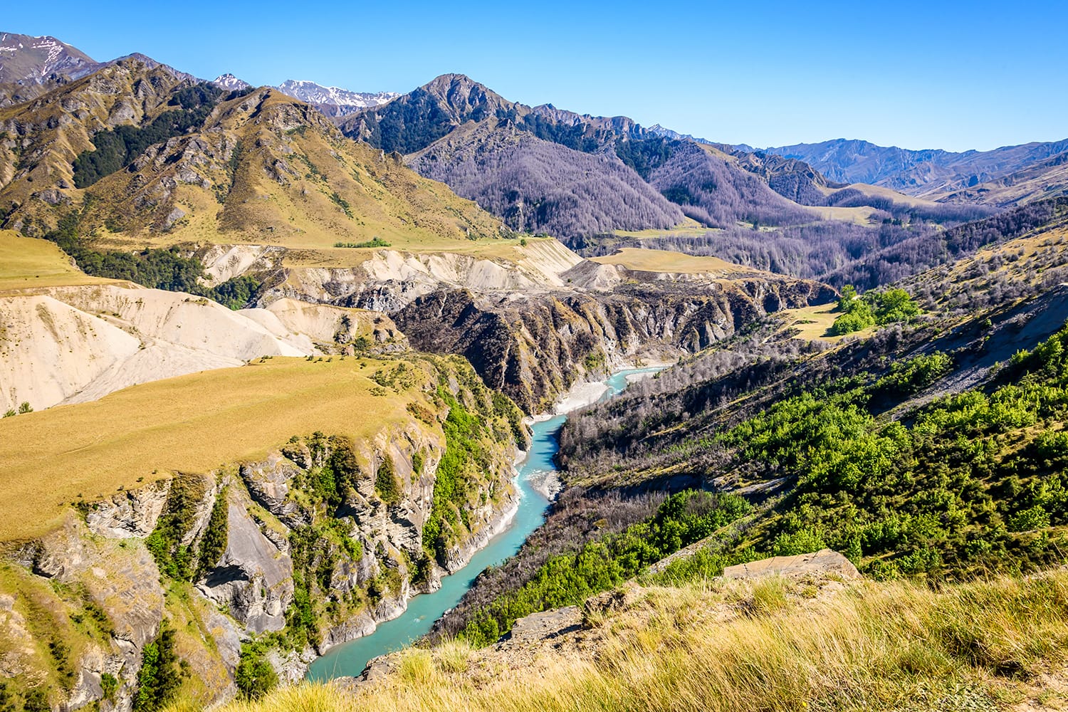 Looking up the valley of the Shotover river in Skippers canyon on a beautiful sunny day, near Queenstown, South Island, New Zealand