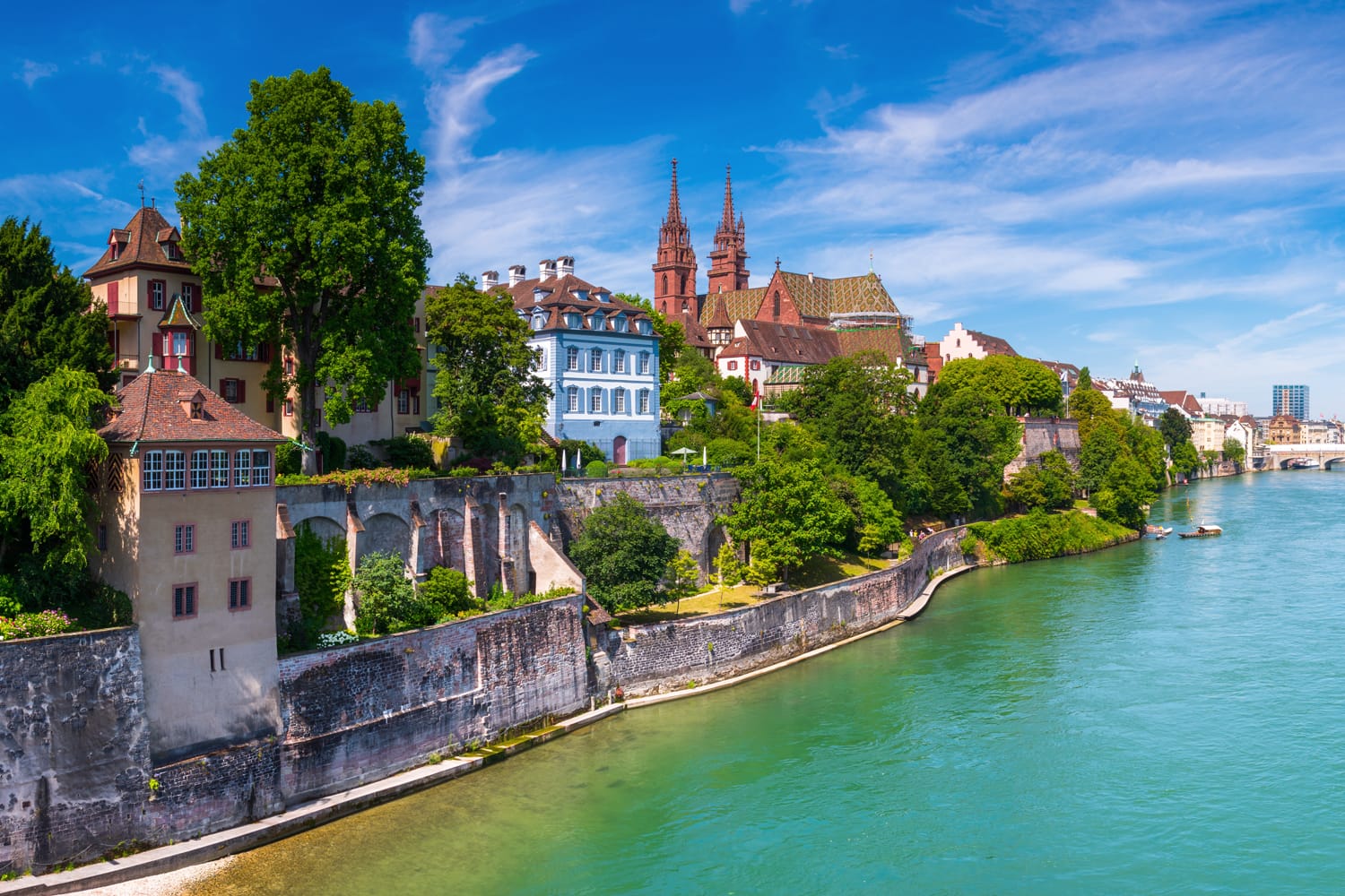 View of the Old Town of Basel with red stone Munster cathedral and the Rhine river, Switzerland.
