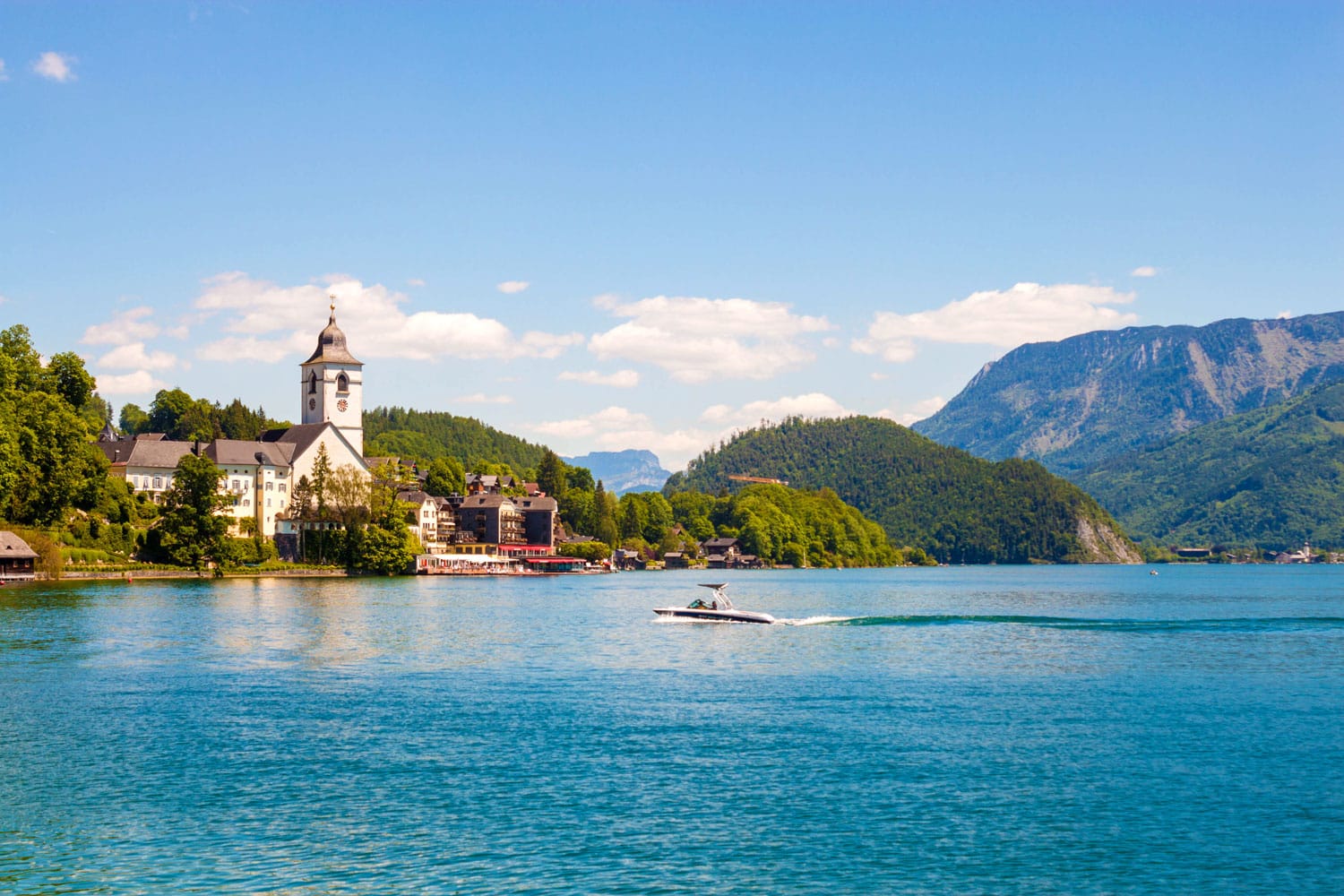 View of St. Wolfgang chapel and the village of St. Wolfgang at Wolfgangsee lake, Austria