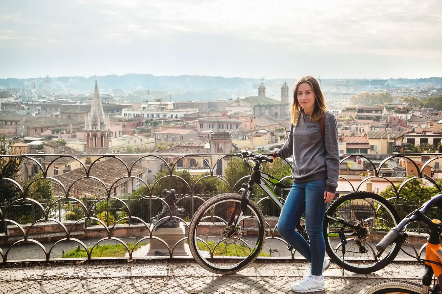 Girl with a bicycle in Rome, Italy