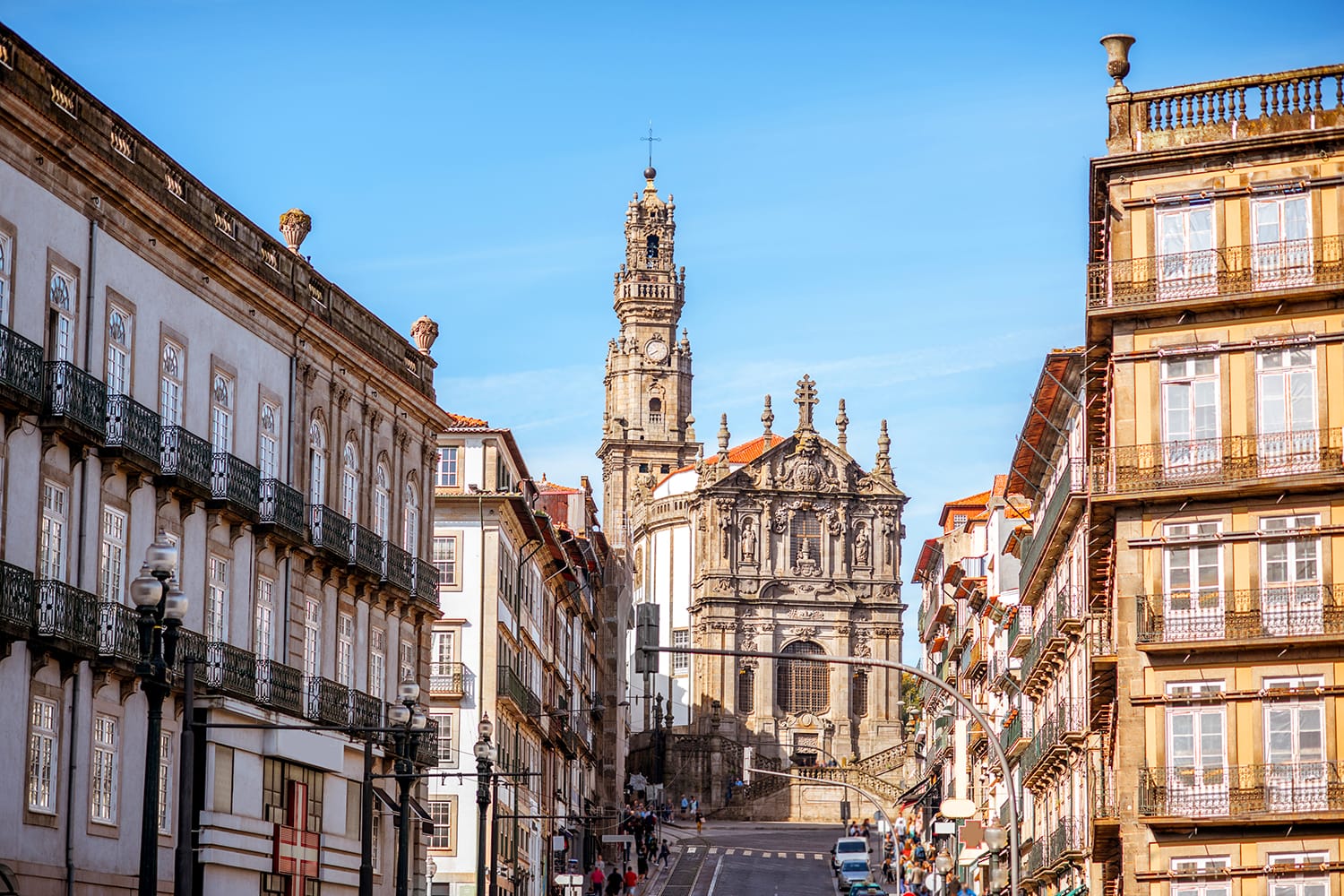 Street view with Clerics church during the sunny day in Porto city, Portugal