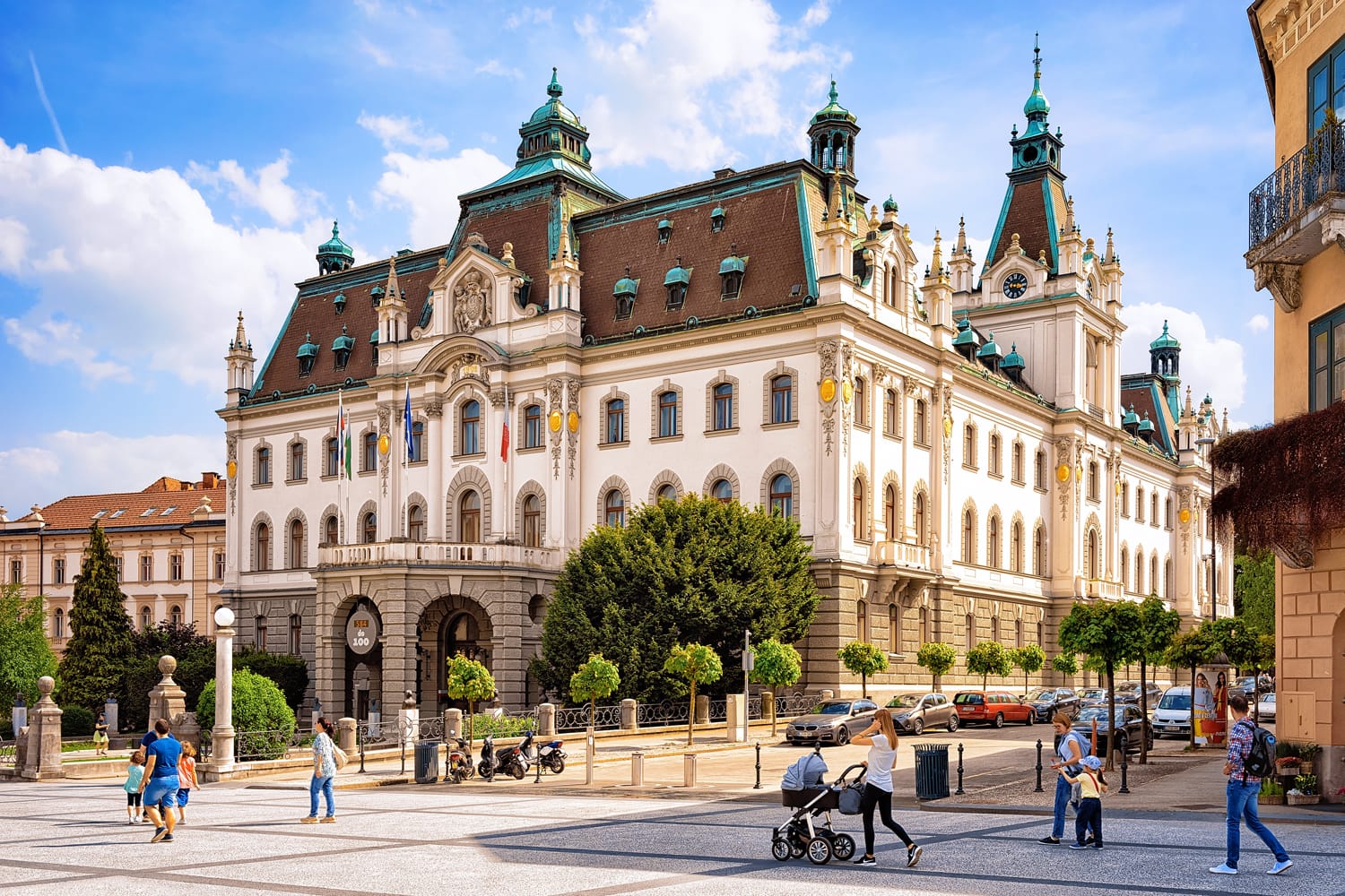 People on Congress Square in the historical center of Ljubljana, Slovenia. University of Ljubljana on the background