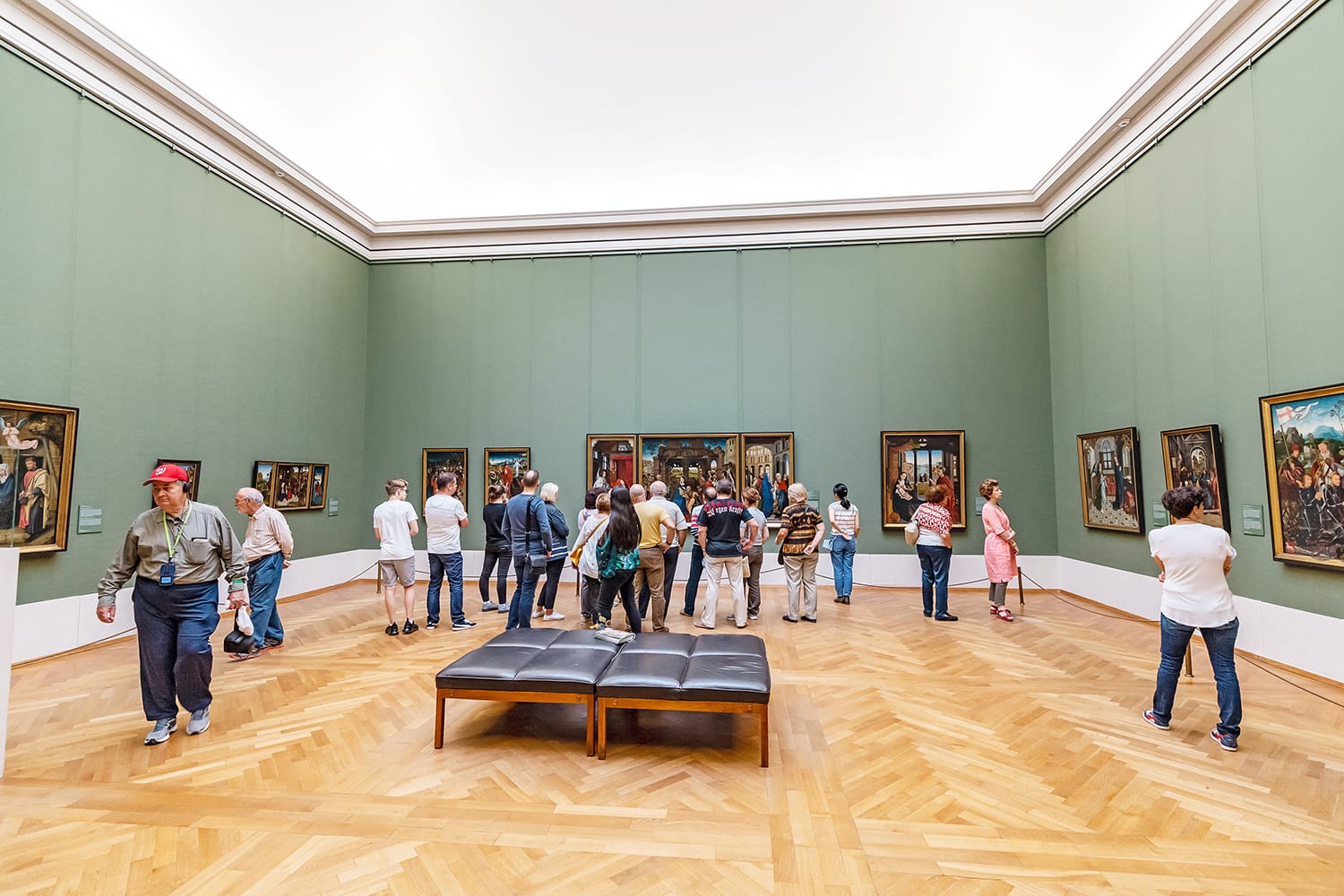 Visitors to the old Pinakothek in Munich admire the paintings of the great masters of antiquity