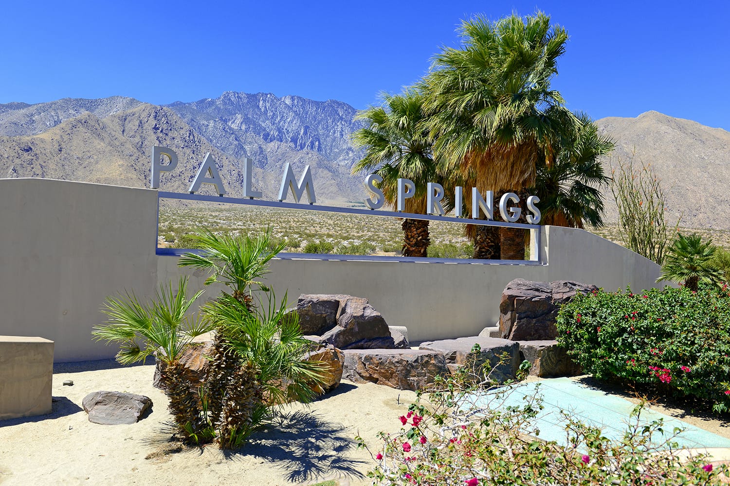 Palm Springs sign with desert background and backdrop of San Jacinto Mountain, California, USA