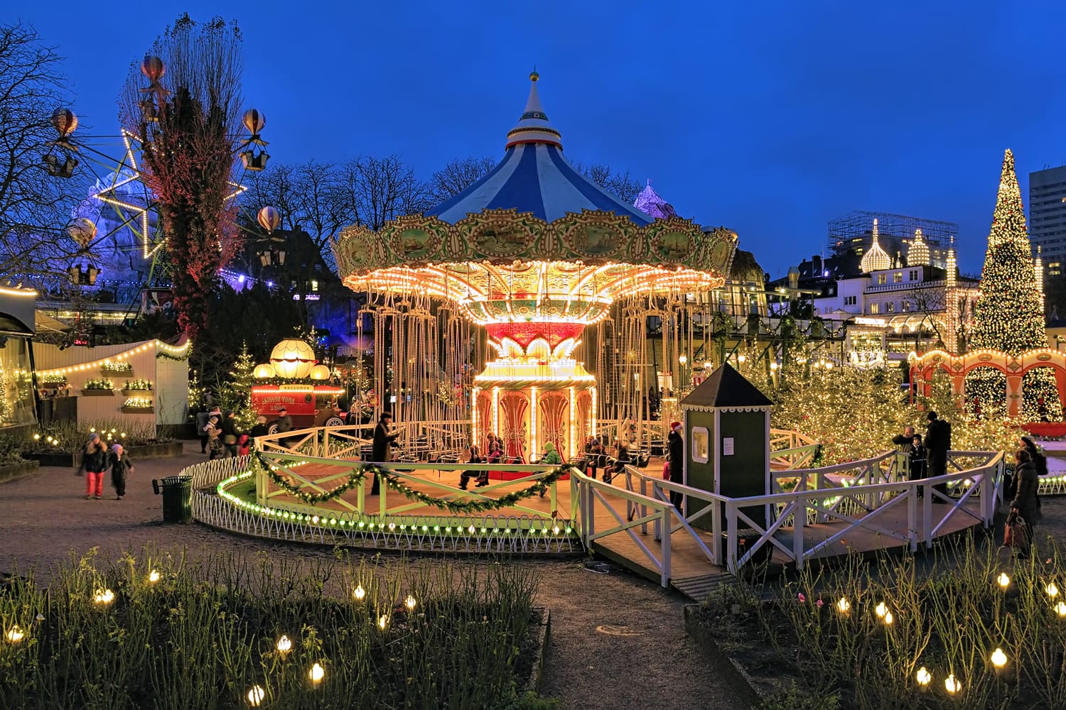 The carousel and christmas illumination in Tivoli Gardens, a famous amusement park and pleasure garden in Copenhagen, Denmark