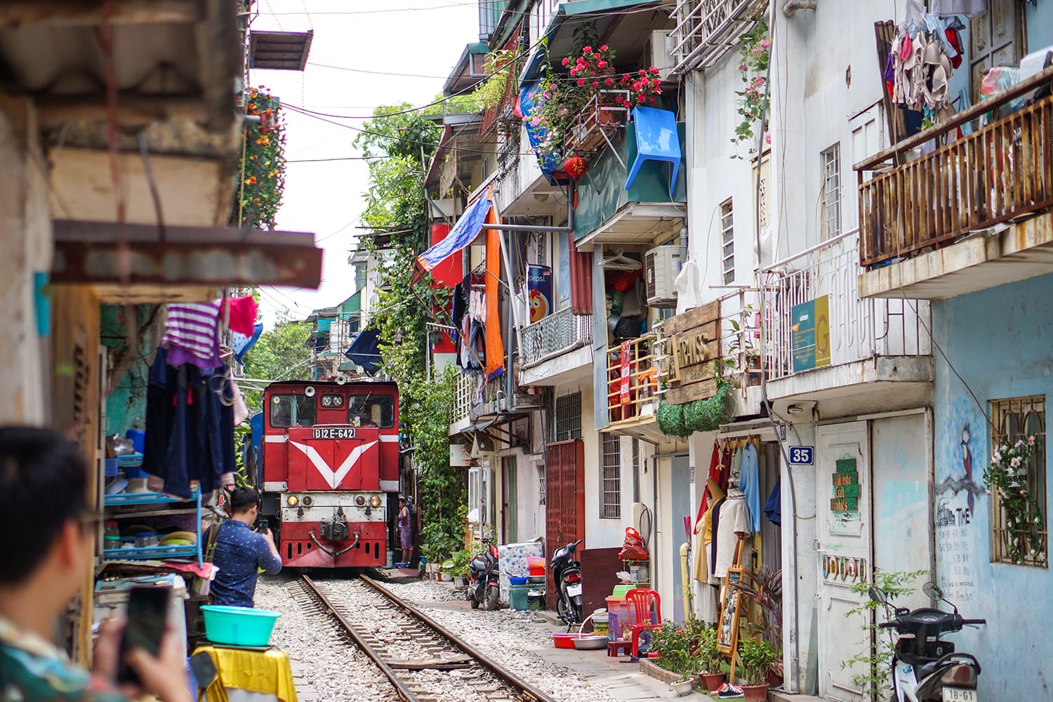 A train running through ancient town in Hanoi.