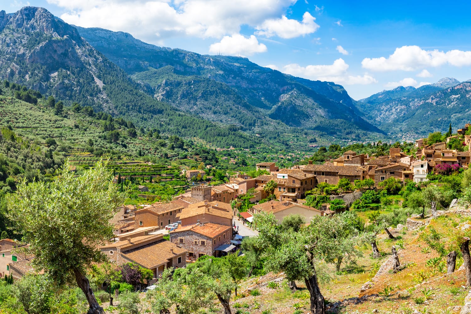 Idyllic panorama view of old village Fornalutx with beautiful mountain landscape of Sierra de Tramuntana on Mallorca, Spain