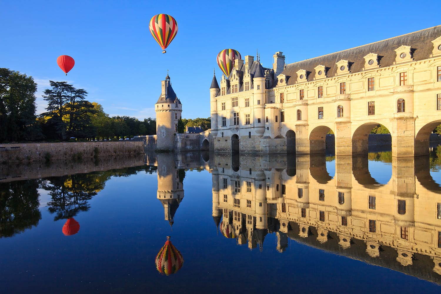 Hot air balloons over Chateau de Chenonceau in the Loire Valley, France
