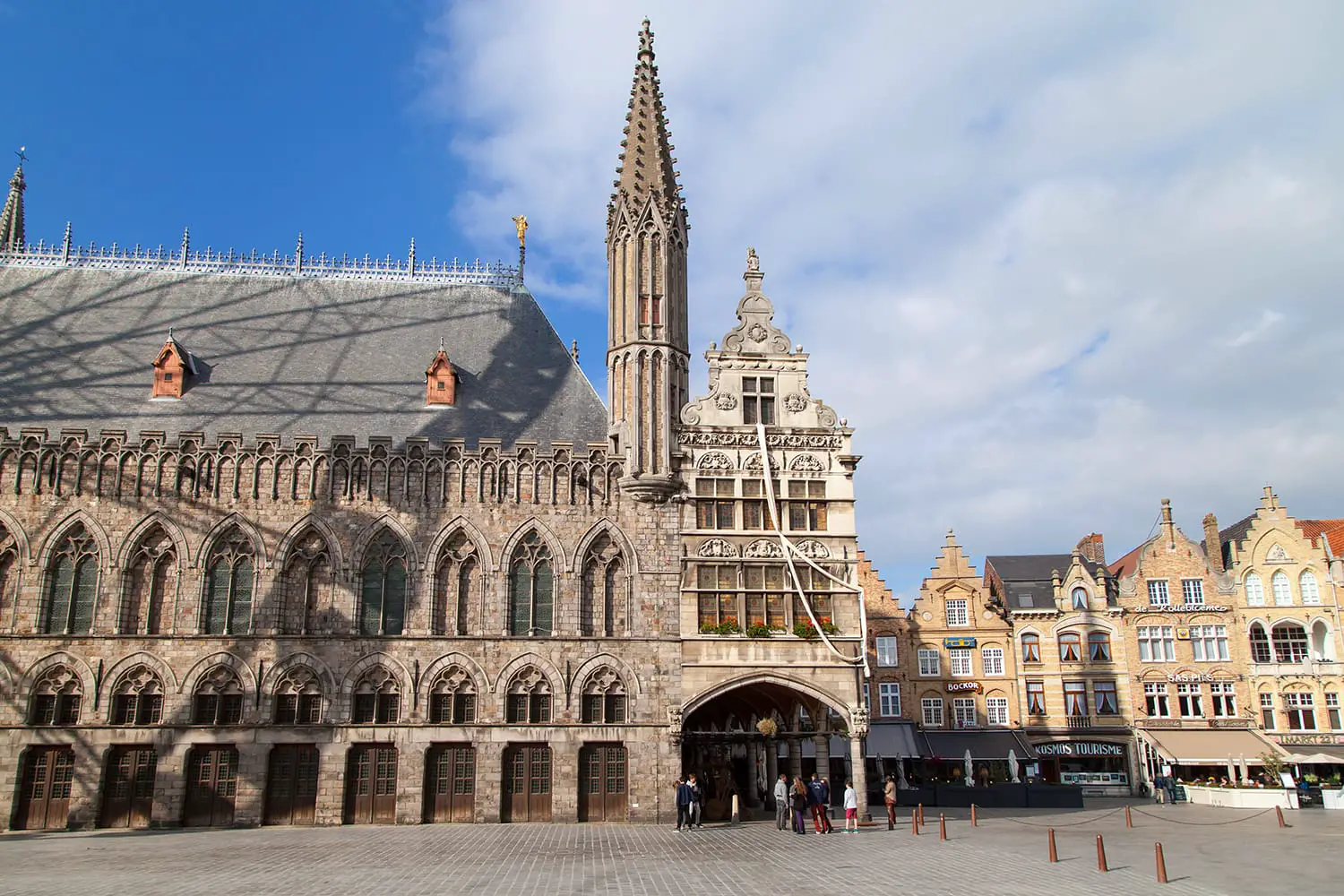 Grote Markt of Ypres, Belgium, with part of the Cloth Hall building on the left and the renaissance building Nieuwerck on the center
