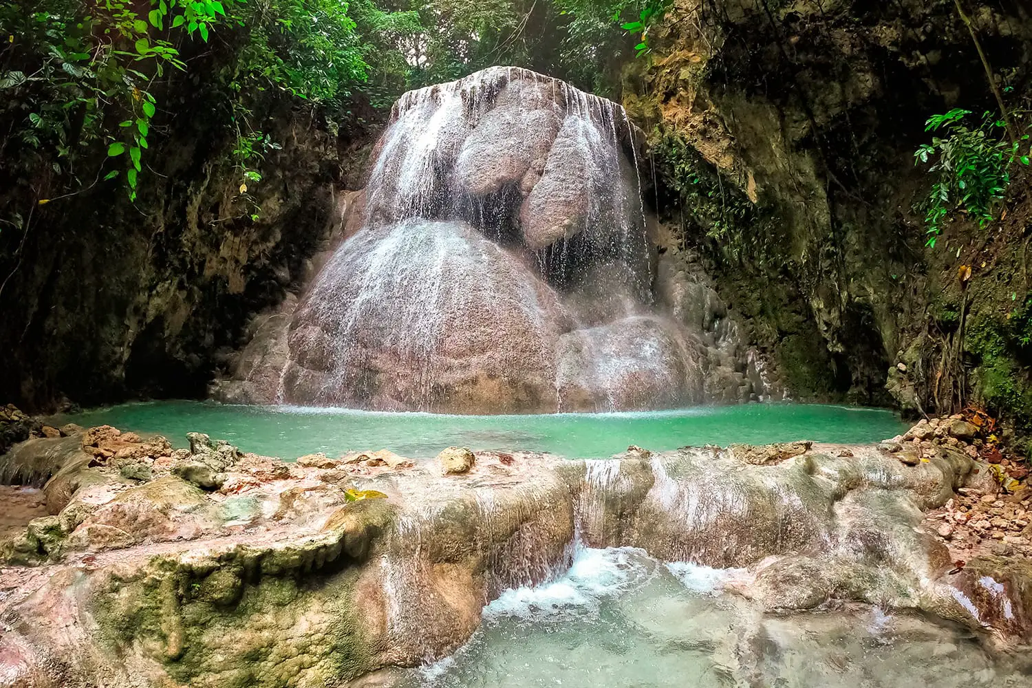 Aguinid waterfall in a mountain gorge in the tropical jungle of the Philippines, Cebu.