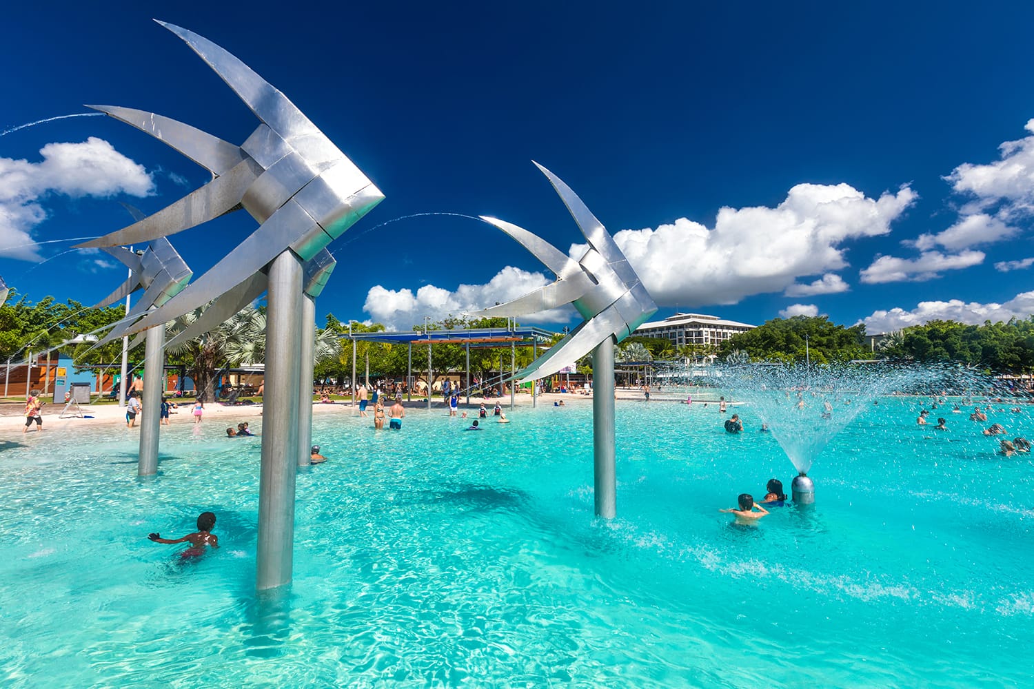 Tropical swimming lagoon on the Esplanade in Cairns with artificial beach; Queensland; Australia.