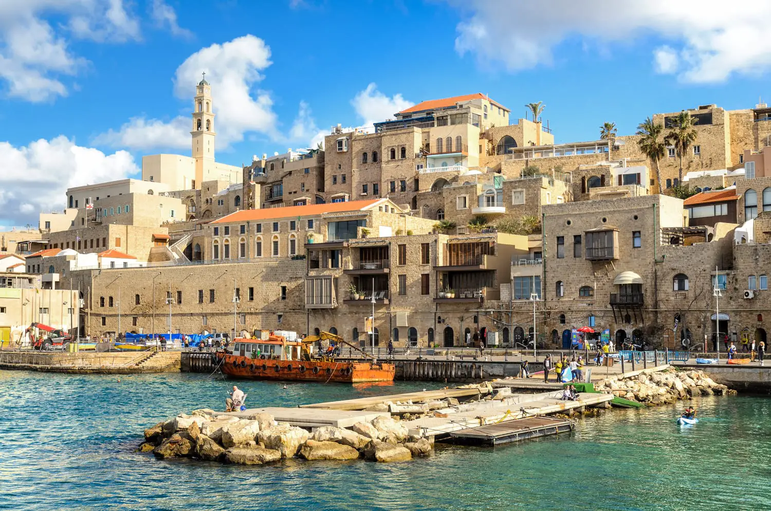 A picturesque view to Jaffa old city and an ancient harbor on a beautiful day. Tel Aviv, Israel.