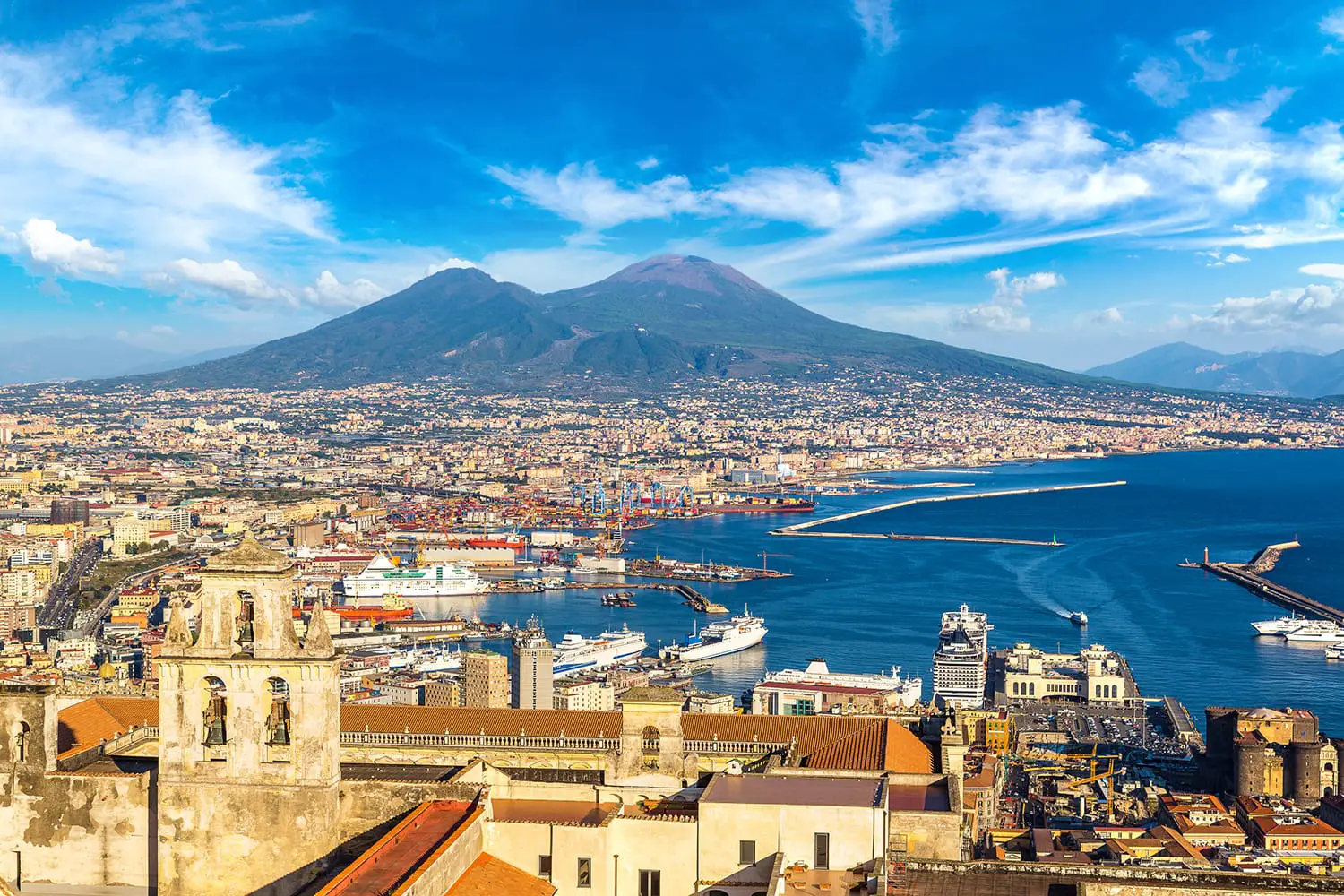 Napoli (Naples) and mount Vesuvius in the background at sunset in a summer day, Italy