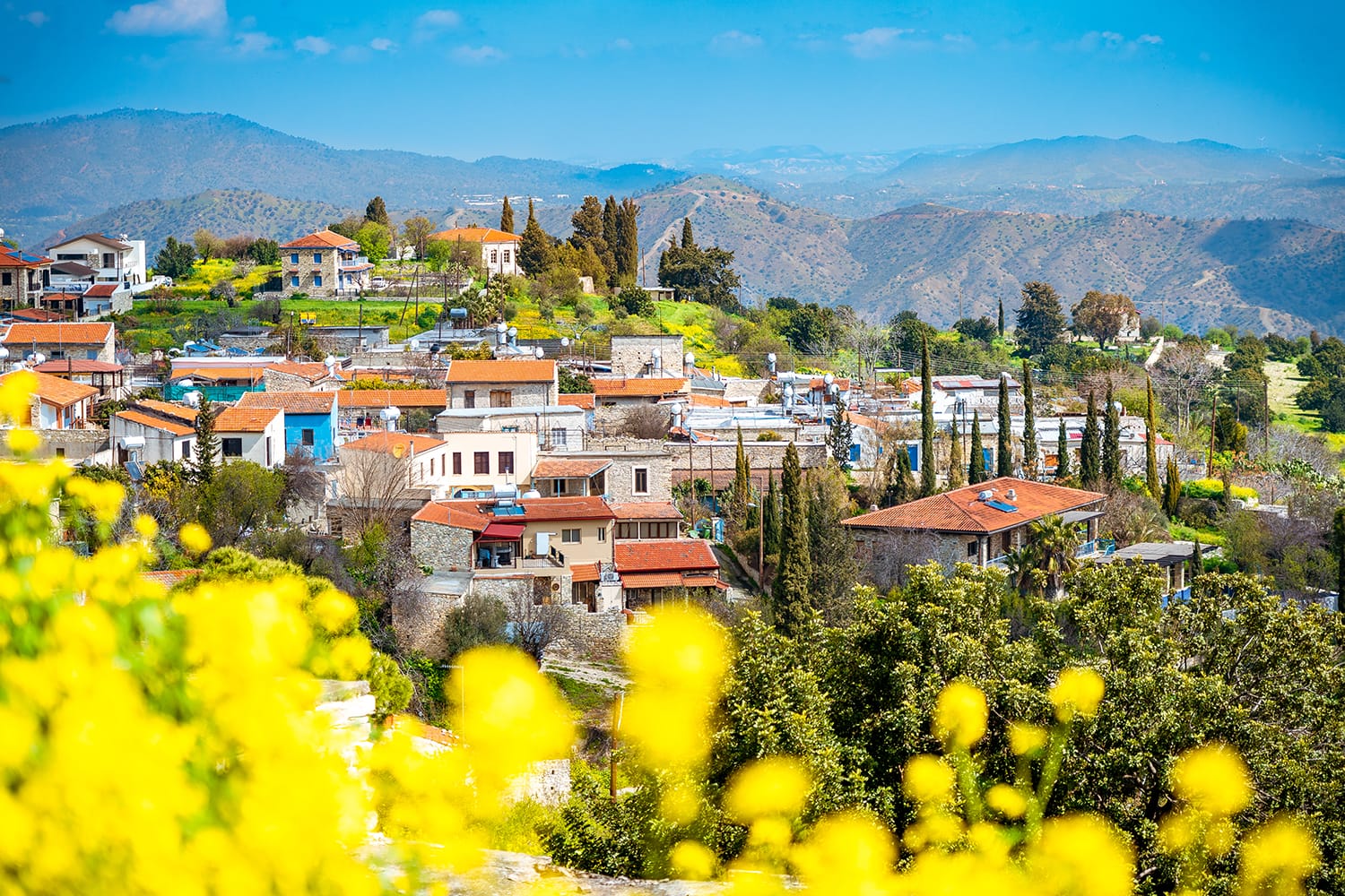 Amazing view of famous landmark tourist destination valley Pano Lefkara village, Larnaca, Cyprus known by ceramic tiled house roofs and Greek orthodox church