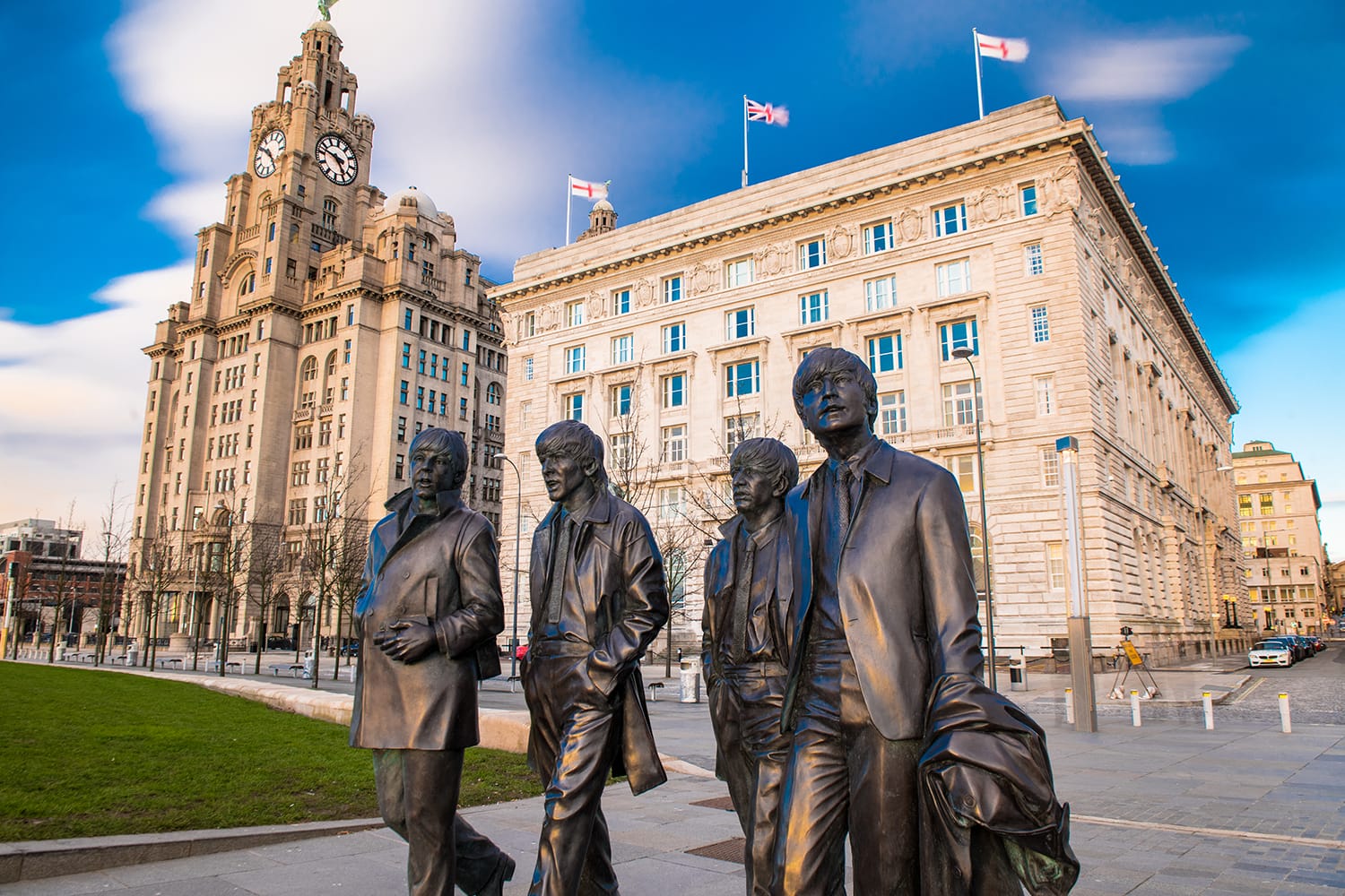 A bronze statue of the four Liverpool Beatles stands on Liverpool Waterfront, UK