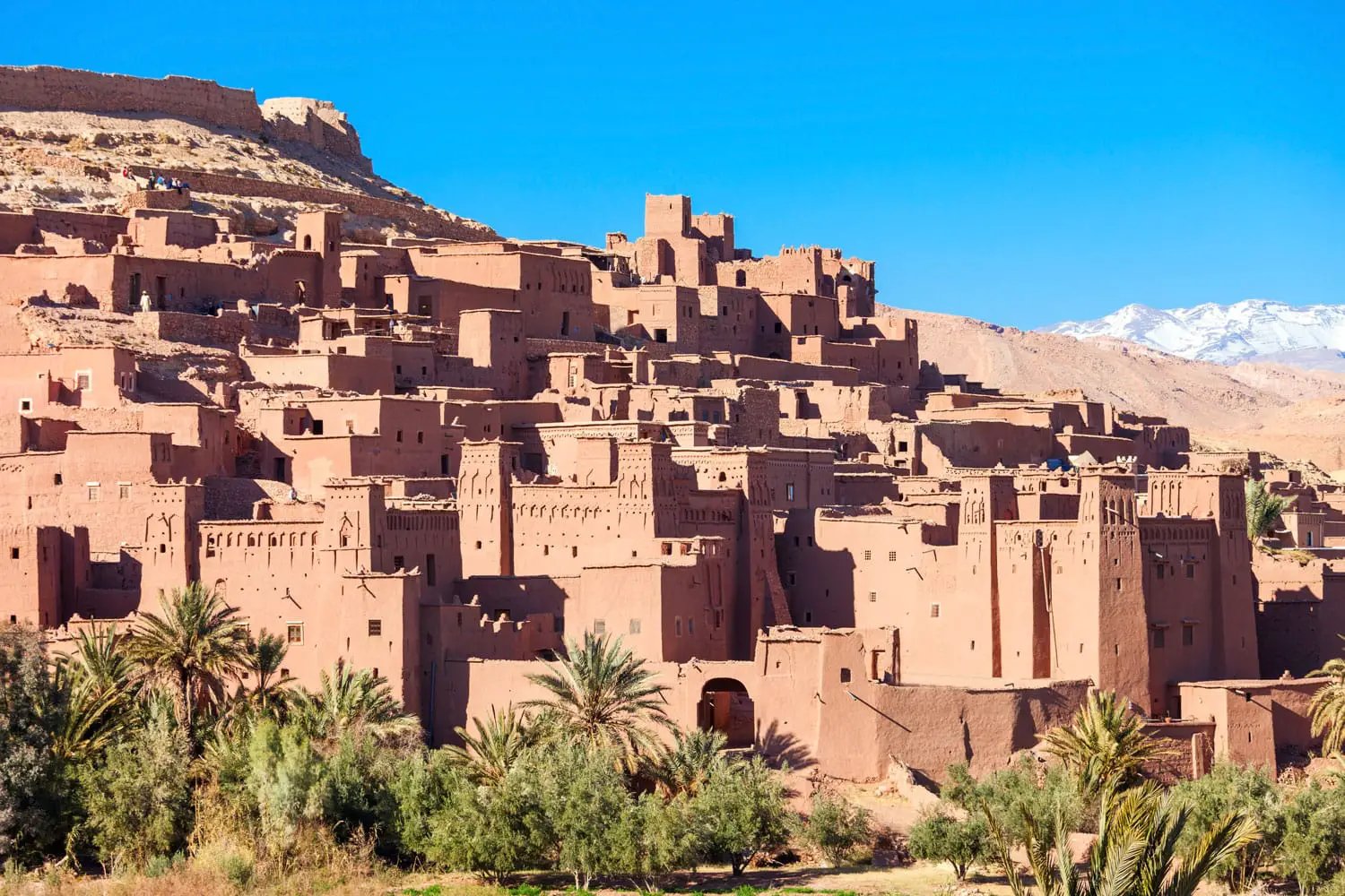 Ait Ben Haddou (or Ait Benhaddou) is a fortified city along the former caravan route between the Sahara and Marrakech in Morocco