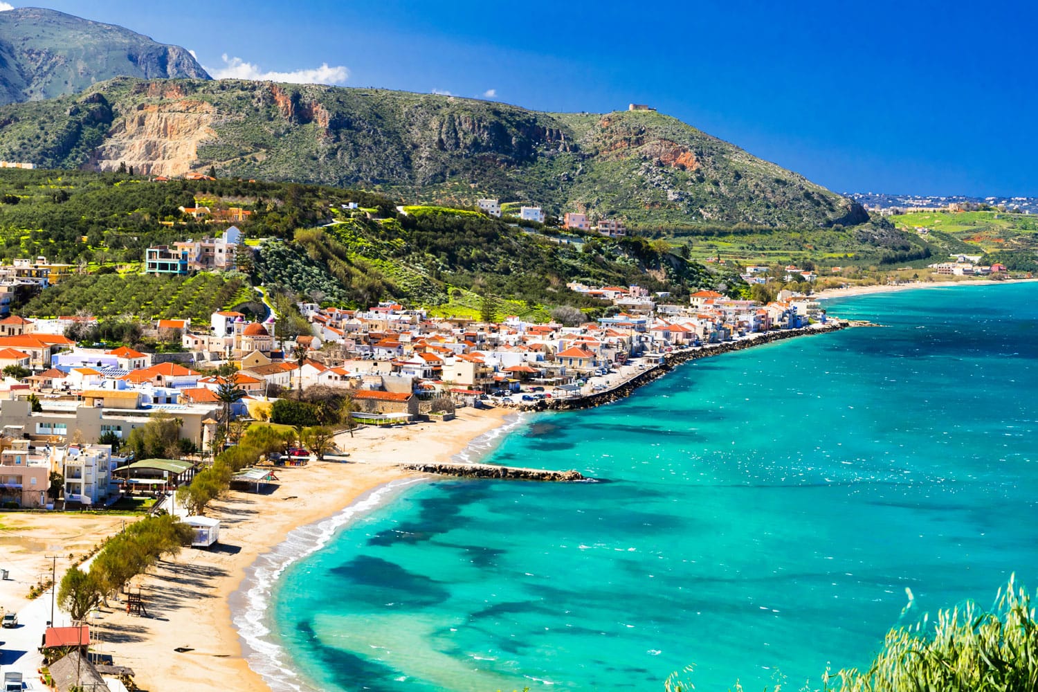 Beautiful Kalyves village on Crete Island with turquoise sea.