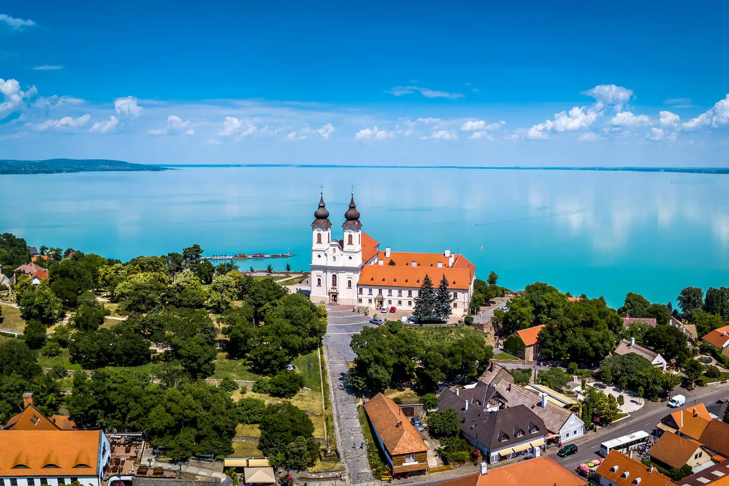 Tihany, Hungary - Aerial panoramic view of the famous Benedictine Monastery of Tihany (Tihany Abbey) with beautiful colourful Lake Balaton at background