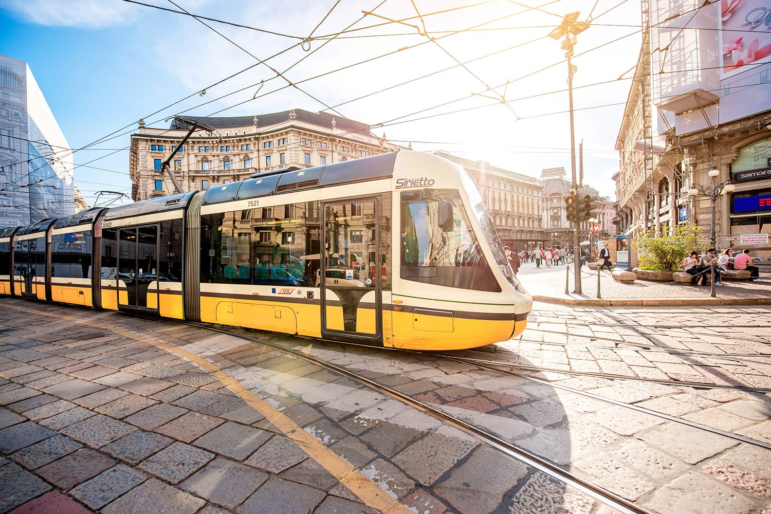 Yellow tram on Cordusio square in Milan, Italy