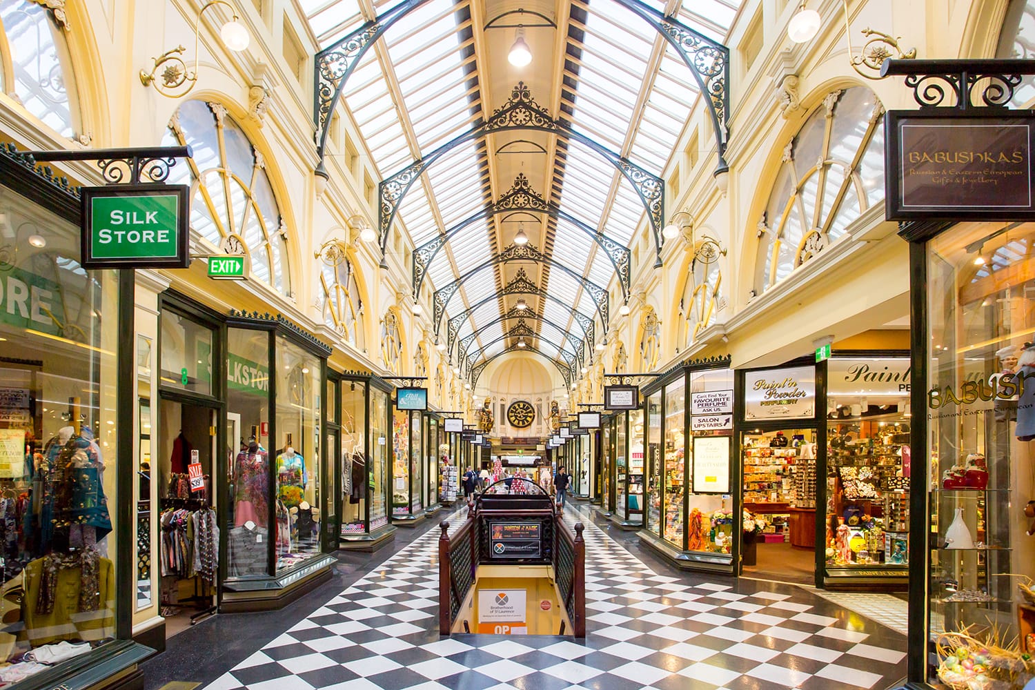 Melbourne's famous Royal Arcade shopping centre during the day with shoppers.