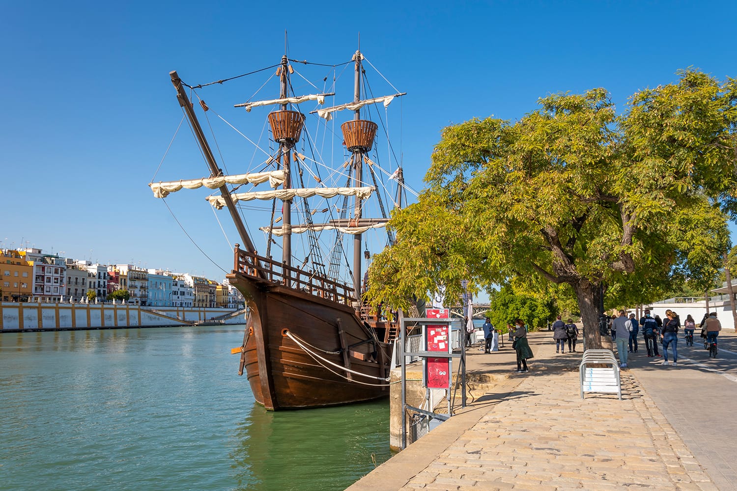 Nao Victoria replica ship docked at the Guadalquivir River in the historic central downtown area of Seville, Spain.