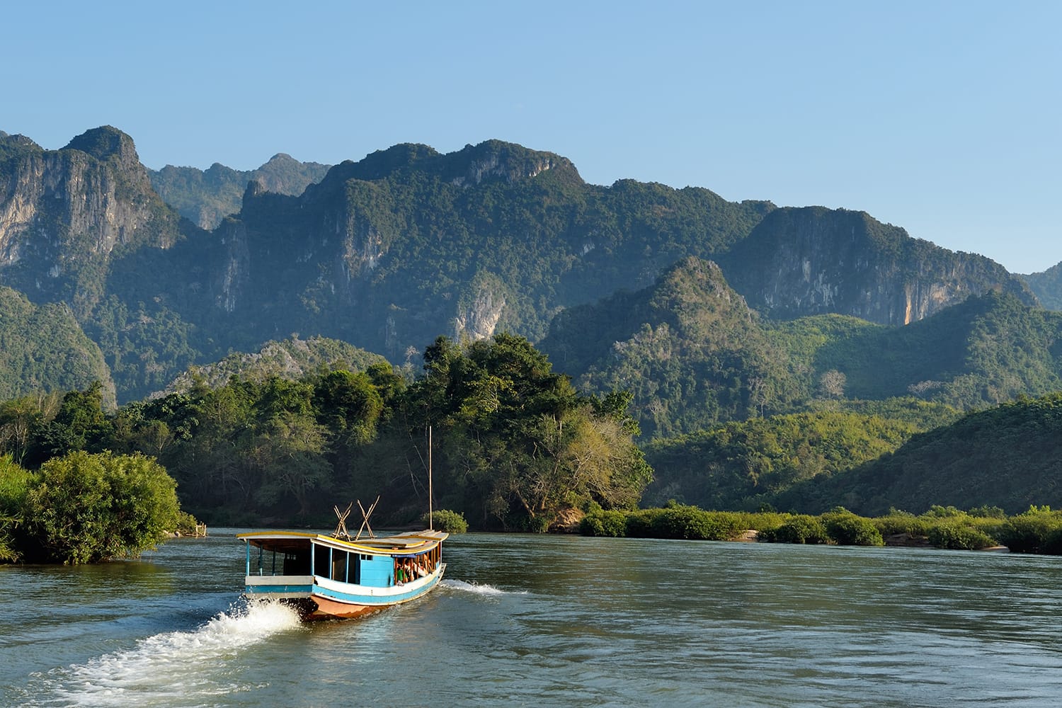 Beautiful landscape with boat tour at Mekong river near Luang Prabang in Laos.