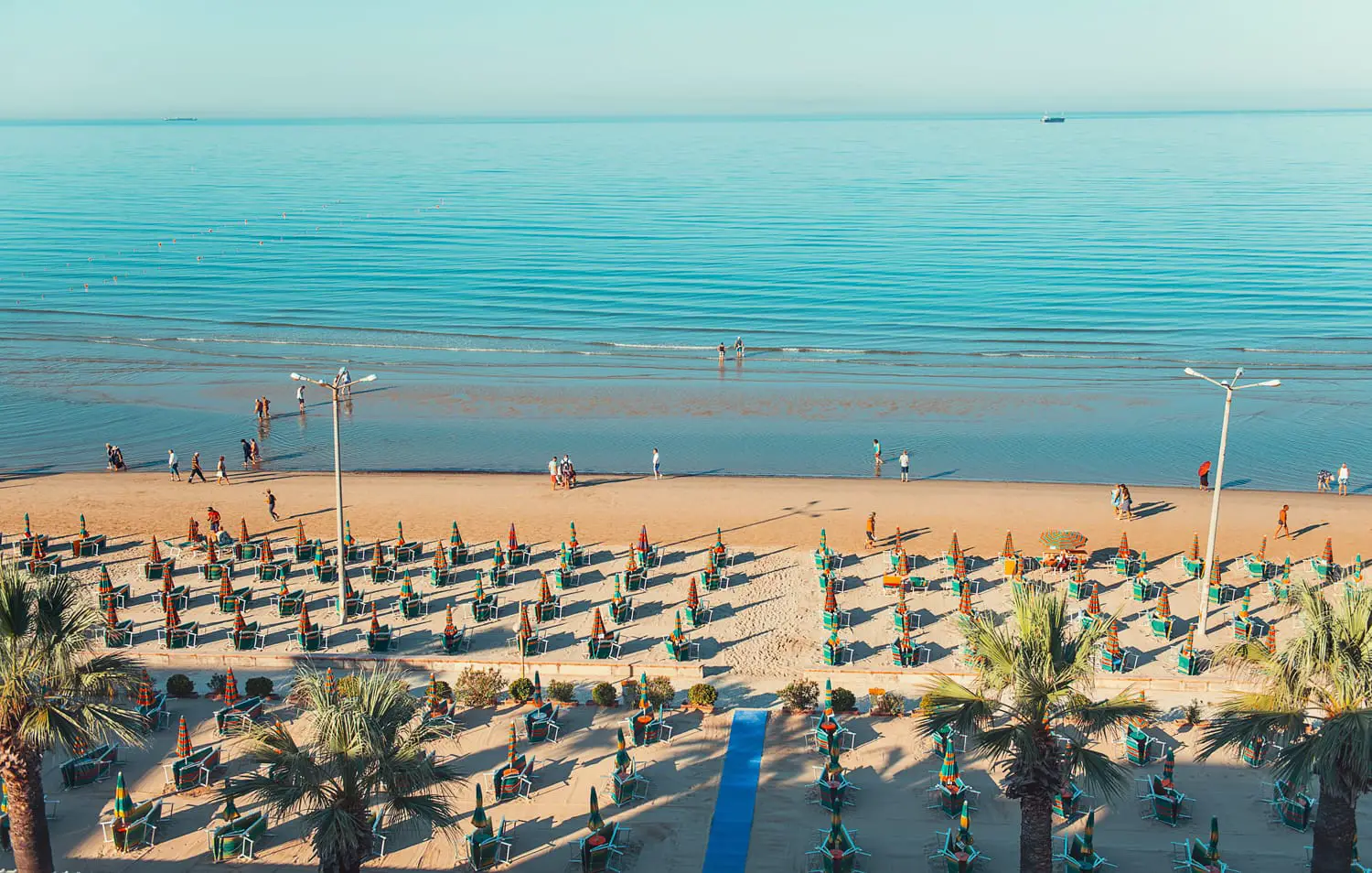 Sandy beach of Durres on the Adriatic seaside of Albania captured early morning in summer.