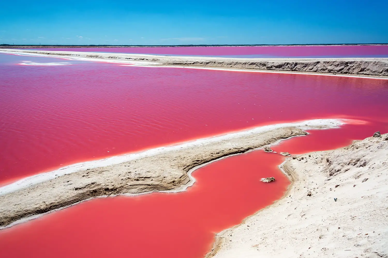 Striking red pool used in the production of salt near Rio Lagartos, Mexico