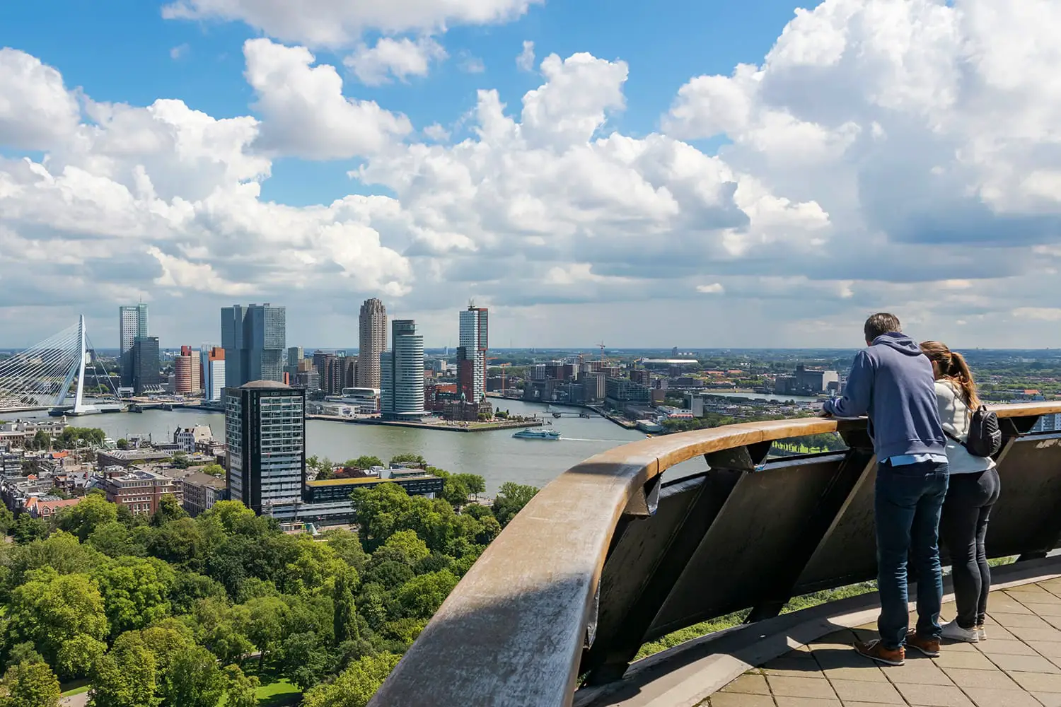 couple looking out over the skyline of Rotterdam from Euromast Tower.