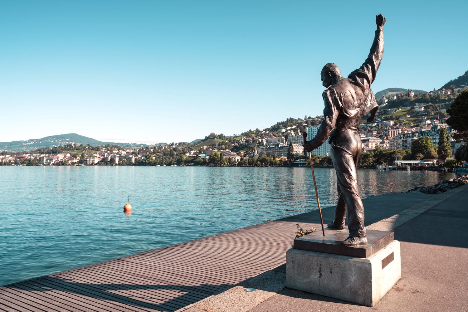 Freddie Mercury former Queen music band leader bronze statue by artist Irena on Geneva Lake shore in Montreux Switzerland