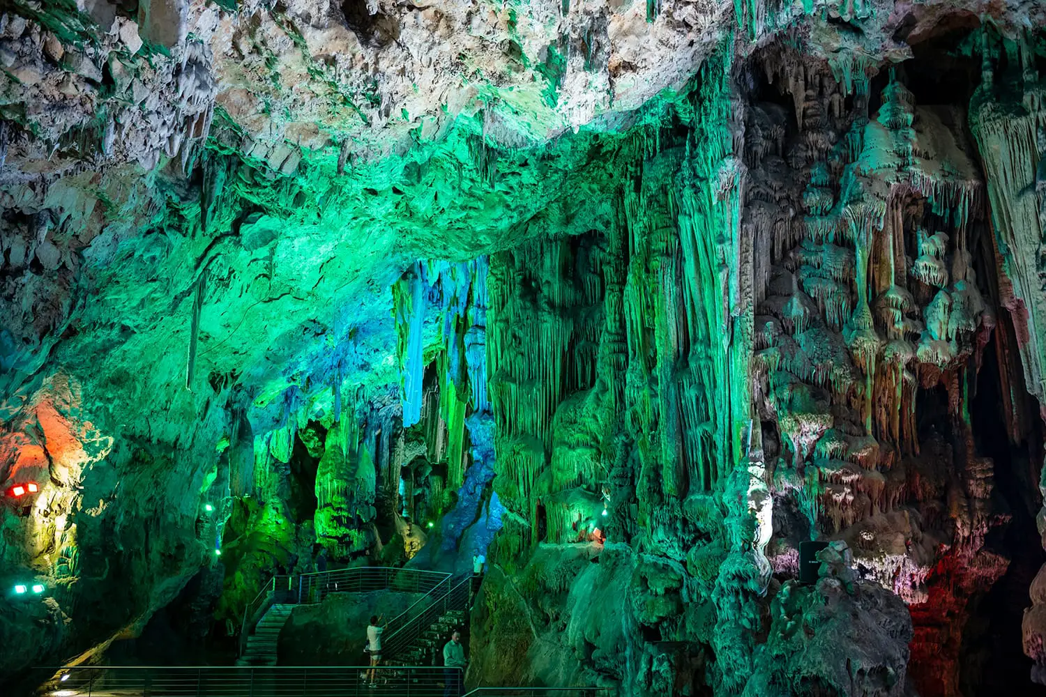 Tourists explore Old St. Michael's Cave, that has been illuminated with colorful LED lighting, located at the Upper Rock Nature Reserve at Gibraltar.